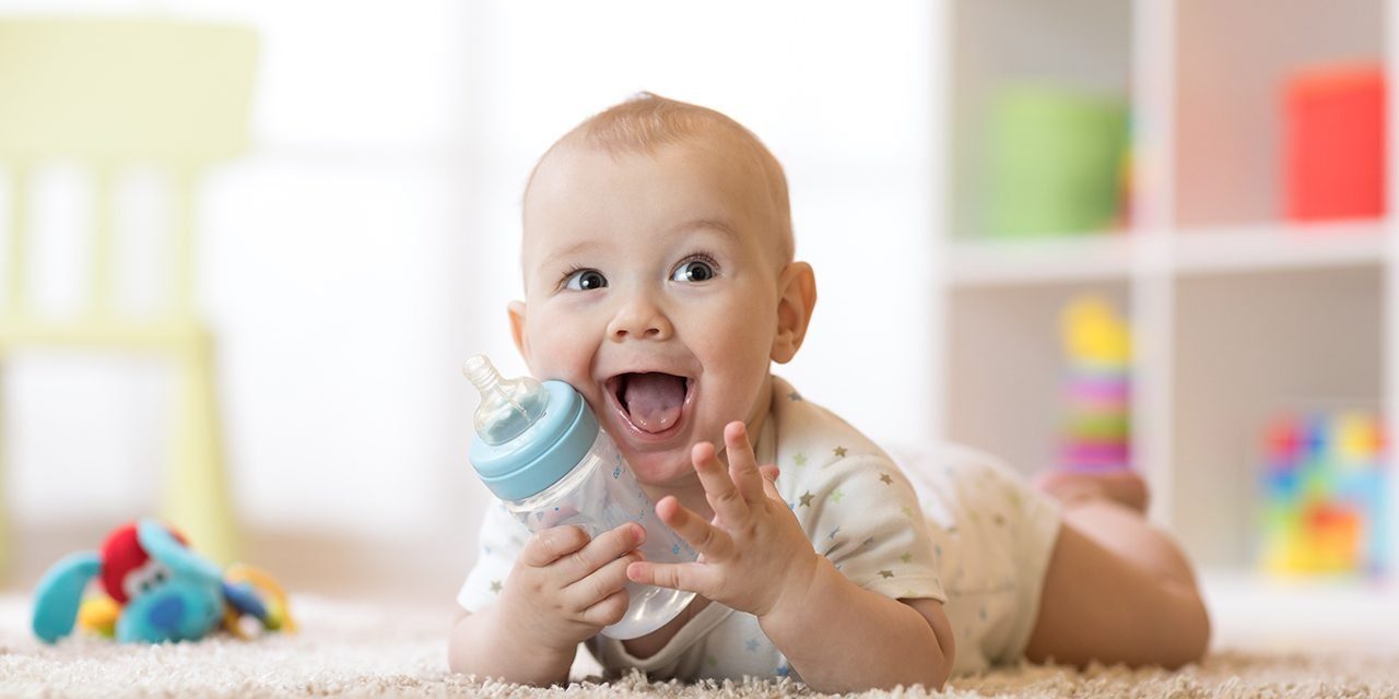 cute-baby-boy-drinking-bottle-kid-shutterstock_1021060435