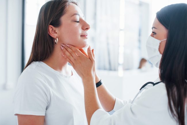 checking-lymph-nodes-and-throat-young-woman-have-2023-11-27-05-31-09-utc-min
